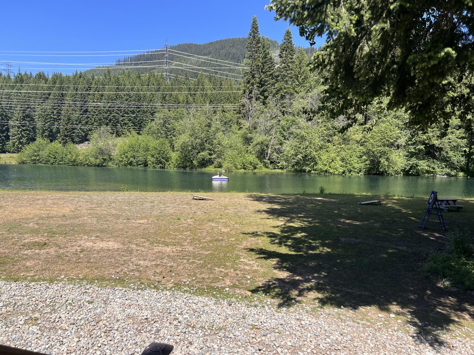 Lakefront view at Alpine Lakes Lodge with mountain forest backdrop